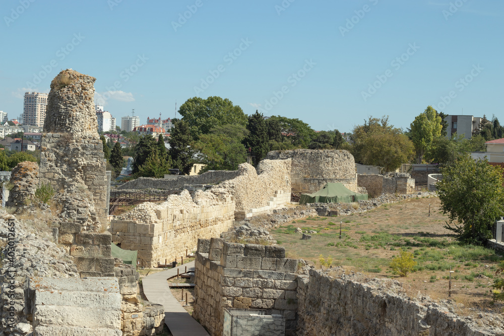 Old stone wall, remains of an ancient settlement, historical excavations, stone houses