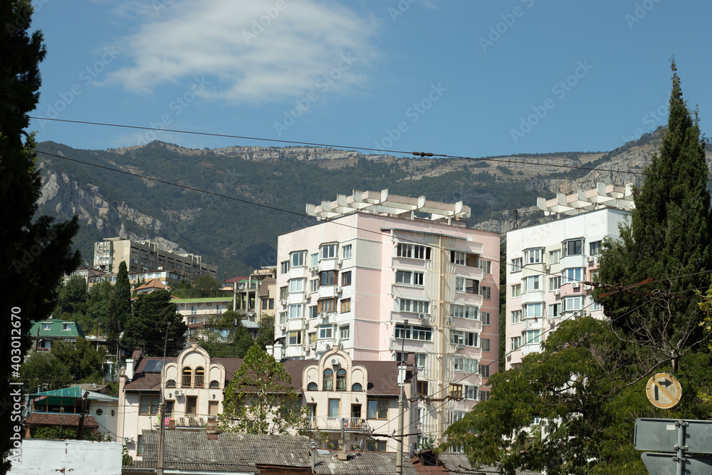 Obraz premium Little town with residential houses in mountains or hill area. natural landscape