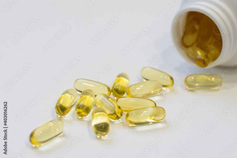 Two Soft Capsules in Palm omega 3 healthy diet concept Two Soft Capsules in Palm omega 3 healthy diet concept