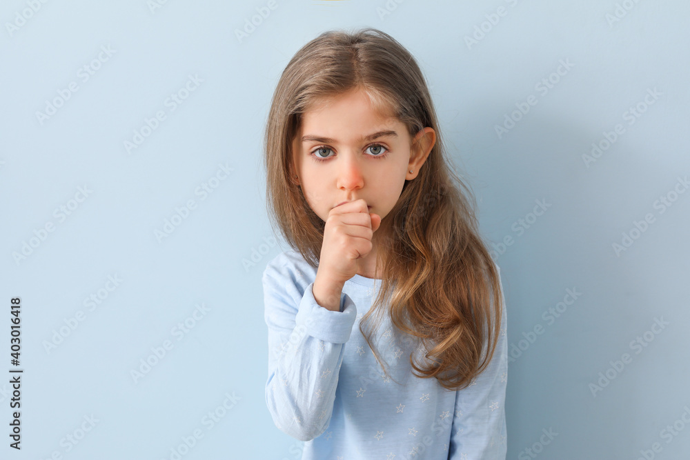 Coughing little girl on color background Coughing little girl on color background