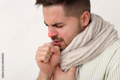 Ill coughing young man on l...