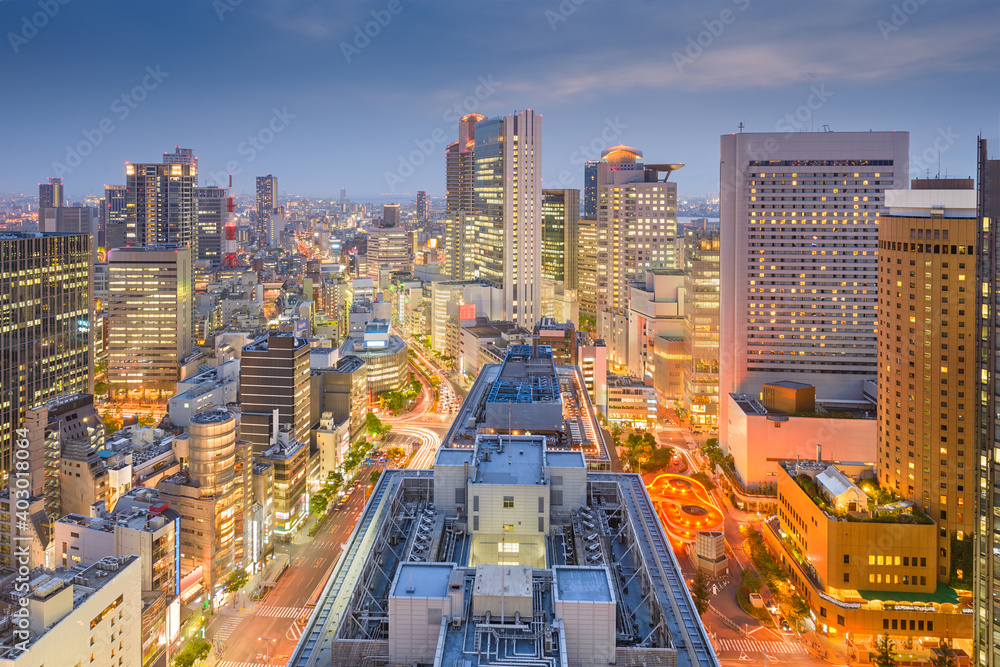 Osaka, Japan downtown city skyline in the Umeda District at dusk.