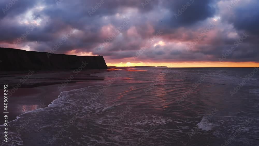 Aerial view sunset over cliffs at the beach Aerial view sunset over cliffs at the beach