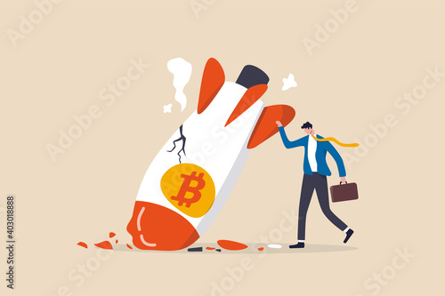 Bitcoin price collapse, crypto currency volatility price roaring fast and fall down causing investor huge loss concept, sad bankrupt businessman with crash fall down rocket with bitcoin symbol.