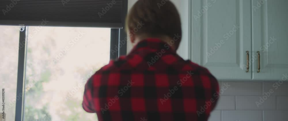 Couple fighting in the kitchen, yelling at each other