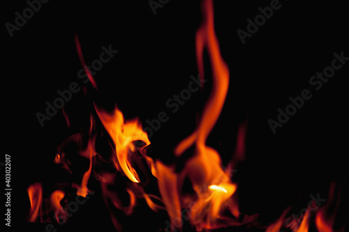Beautiful pictures of fire flame against black background as symbol of hell and eternal pain in Christian tradition.. Horizontal image.