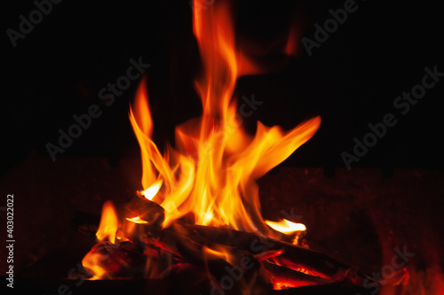 Beautiful pictures of fire flame against black background as symbol of hell and eternal pain.