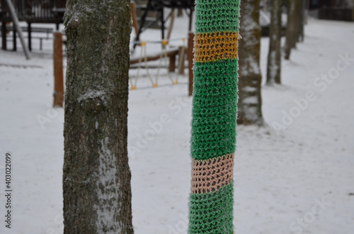 knitted sleeves on lamps appear around the cities. it is an activity that has a harmless to slightly beautifying effect. the activity is called guerrilla kitting. photo
