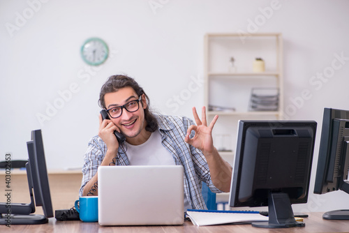 Young male it specialist working in the office