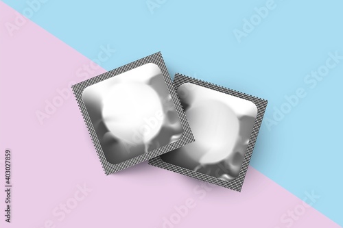 Two silver condom packages. Blank foil wrapper vector illustration. Realistic design of contraceptive product on blue and pink background. Plastic bright square packs of condoms