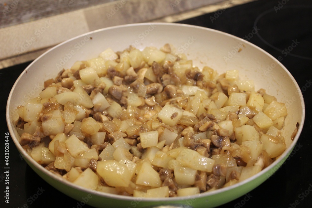 Fried potatoes with mushrooms and onions.
Fried potatoes with mushrooms and onions.