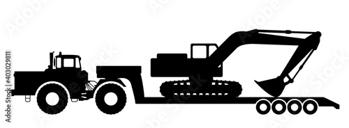 Silhouette of an excavator on a tractor trawl.
