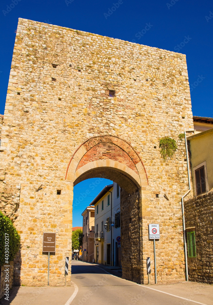 The 14th century south gate in the city walls of the historic medieval village of Paganico near Civitella Paganico in Grosseto Province, Tuscany, Italy
