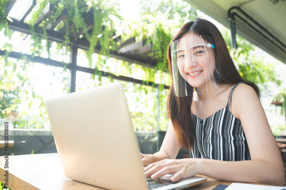 young asian woman wearing surgical face shield for protection virus disease, pandemic healthy safety young asian woman wearing surgical face shield for protection virus disease, pandemic healthy safety