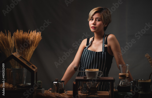 Asian barista girl making c...
