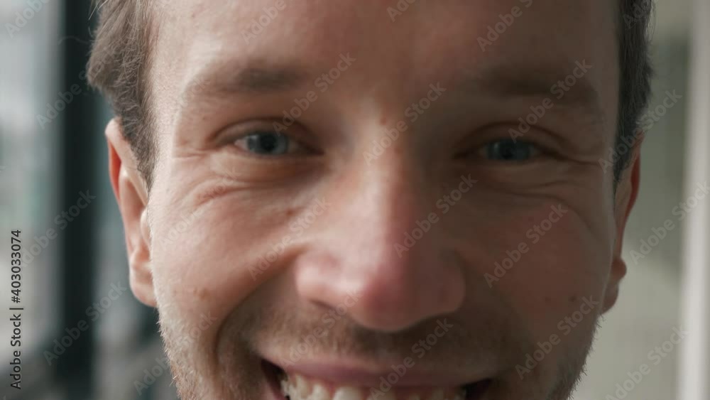 Close up portrait of handsome businessman smiling cheerfully to the camera. In formal wear standing indoor. Close up young stylish happy banker advisor executive manager leader ceo owner entrepreneur Close up portrait of handsome businessman smiling cheerfully to the camera. In formal wear standing indoor. Close up young stylish happy banker advisor executive manager leader ceo owner entrepreneur