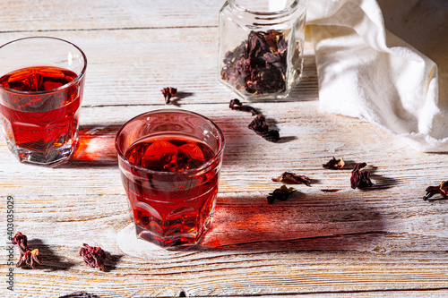 Hibiscus tea and dry rose petals, hard light with harsh shadows