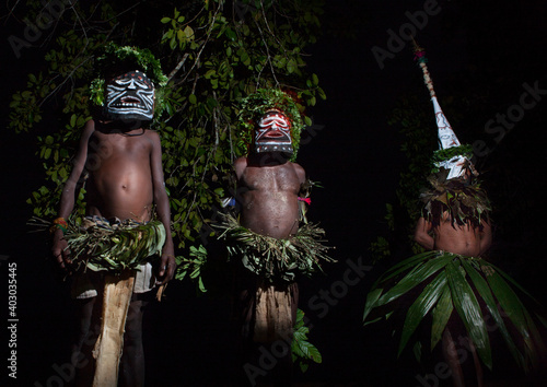 Men during a Malagan tatuana masks dance, New Ireland Province, Langania, Papua New Guinea photo