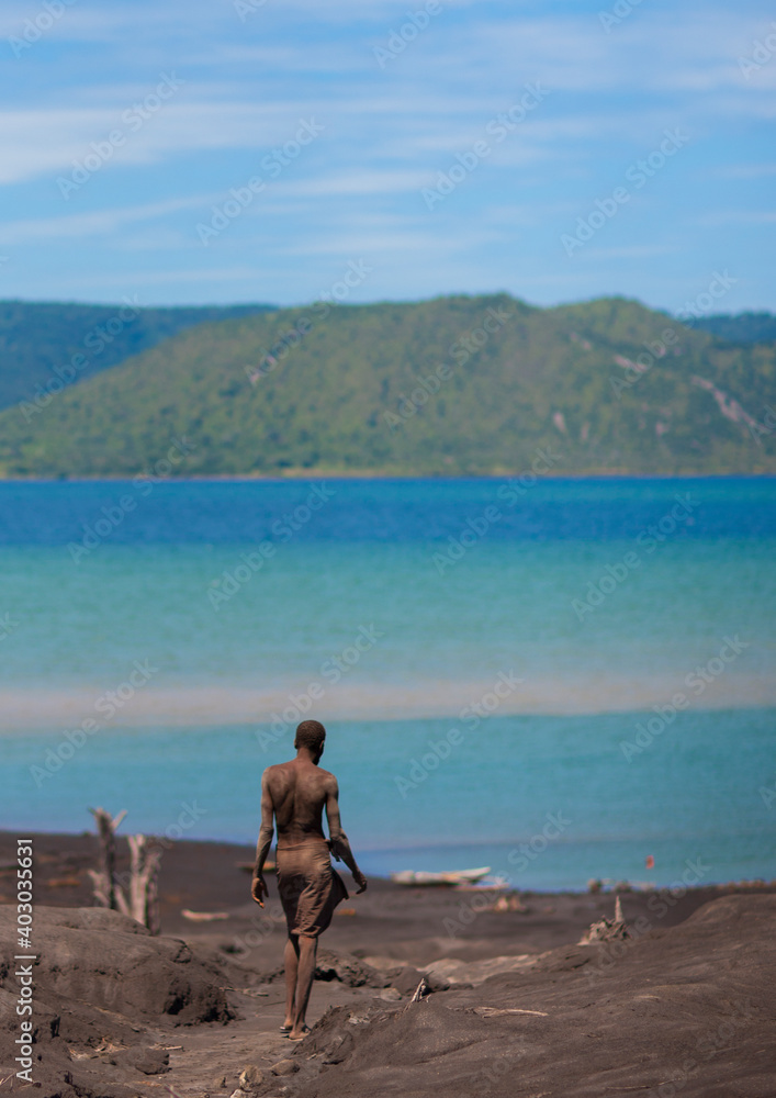 Man digging to find megapode birds eggs in Tavurvur volcano ashes, East New Britain Province, Rabaul, Papua New Guinea Man digging to find megapode birds eggs in Tavurvur volcano ashes, East New Britain Province, Rabaul, Papua New Guinea