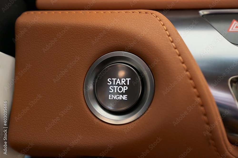 Starting the engine of a car with button - obrazy, fototapety, plakaty 