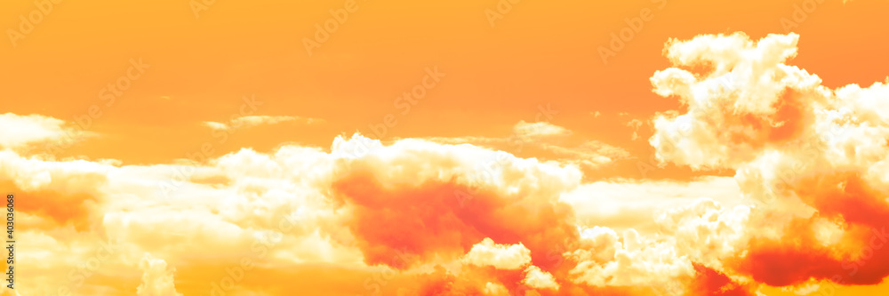 Fototapeta Bright sky with clouds toned in yellow-orange color