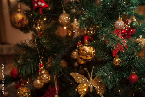 Decorated Christmas tree on a blurry background.