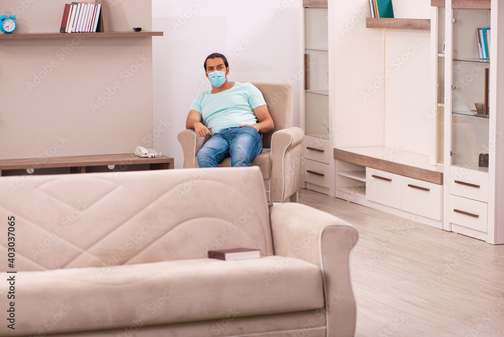 Young man sitting at home during pandemic Young man sitting at home during pandemic
