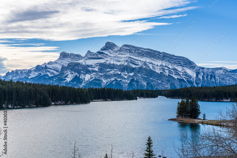 Two Jack Lake in early winter sunny day. Banff National Park, Canadian Rockies, Alberta, Canada.