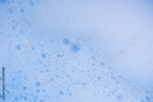 Abstract background white soapy foam texture. Shampoo foam with bubbles