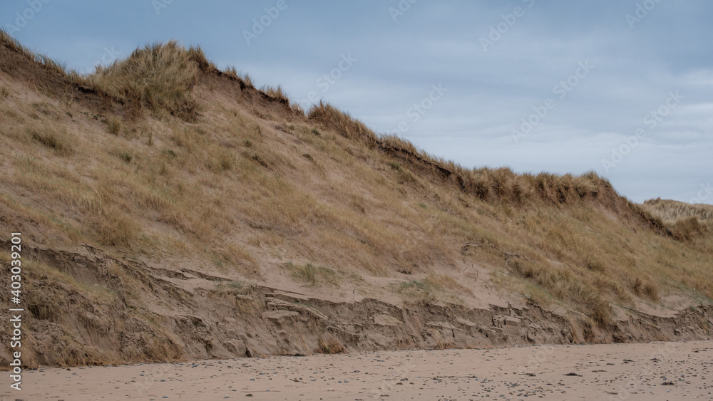Sand dunes after erosion on beach