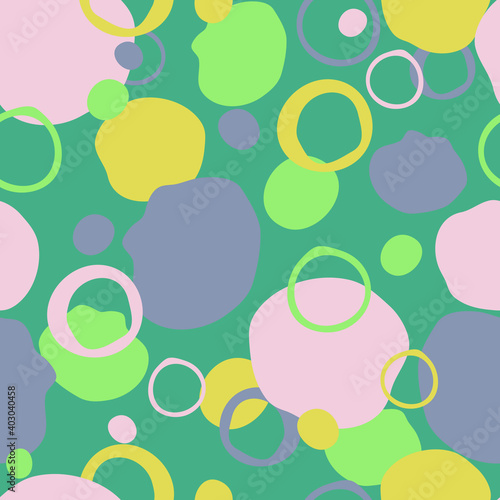 Seamless vector pattern with colourful splodges on green background. Happy paint texture wallpaper design. Decorative fashion textile art.