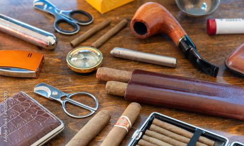 Obraz na plátně Smoking tobacco set and accessories on wooden desk