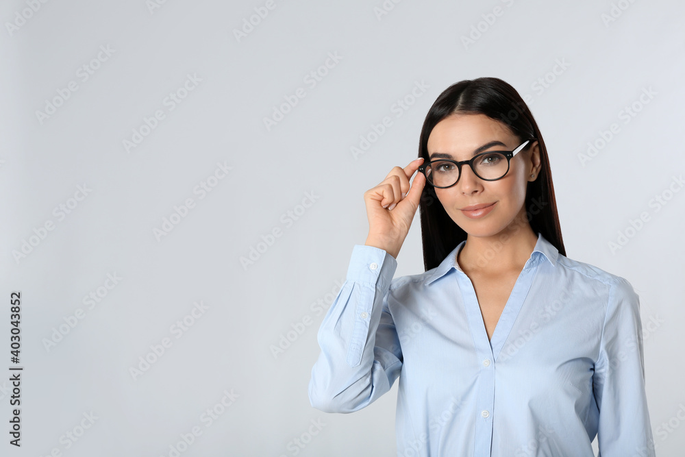 Portrait of young businesswoman on white background. Space for text