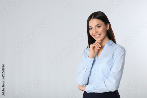 Portrait of young businesswoman on white background. Space for text