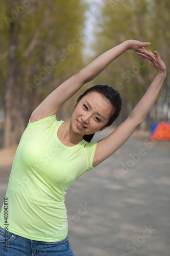 A young beauty woman doing exercise outdoors © eastfenceimage