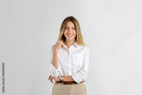 Portrait of beautiful young businesswoman on white background