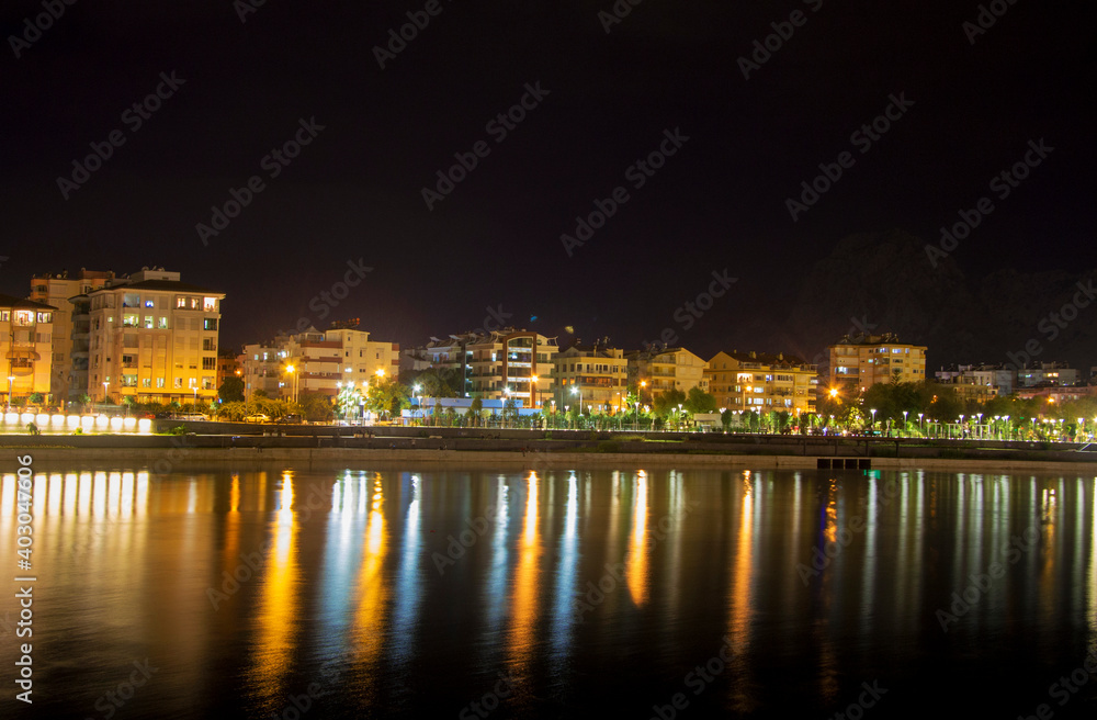 Nght river in Antalya Konyalti and the town line at night time