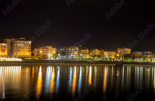 Nght river in Antalya Konyalti and the town line at night time © scullery
