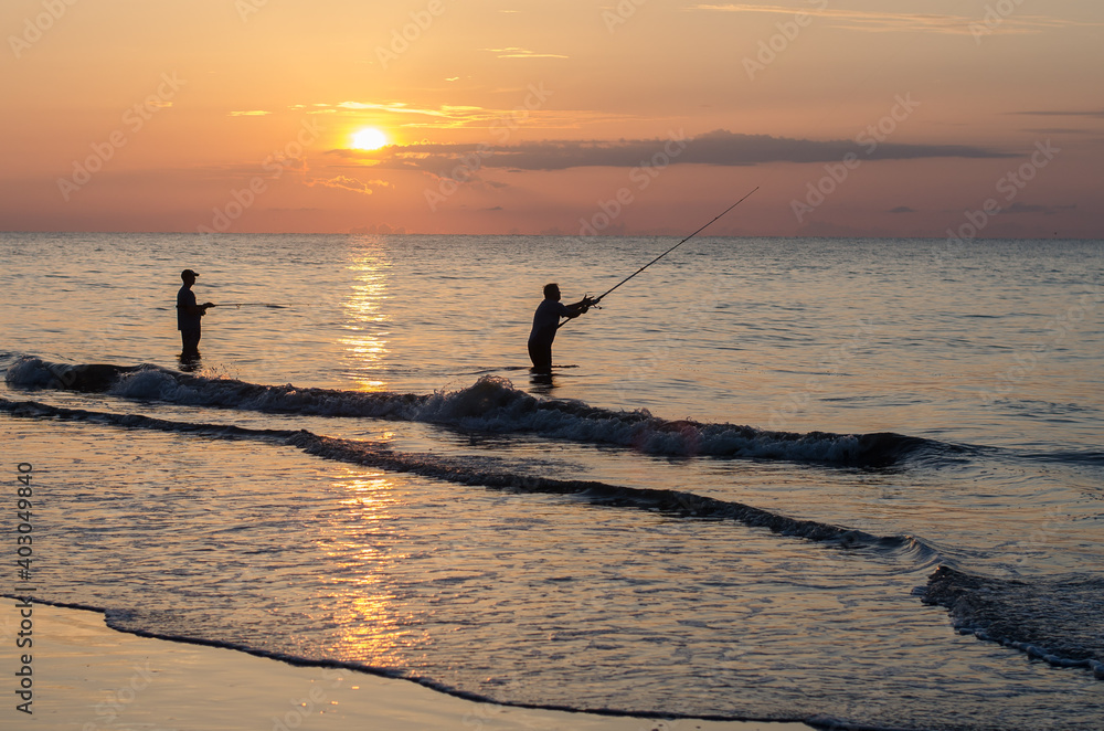 Fisherman at sunrise on Hilton Head Island, South Carolina.