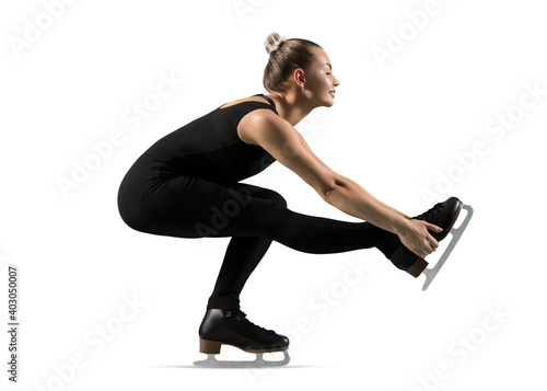 Sit spin. Woman figure skating in action isolated