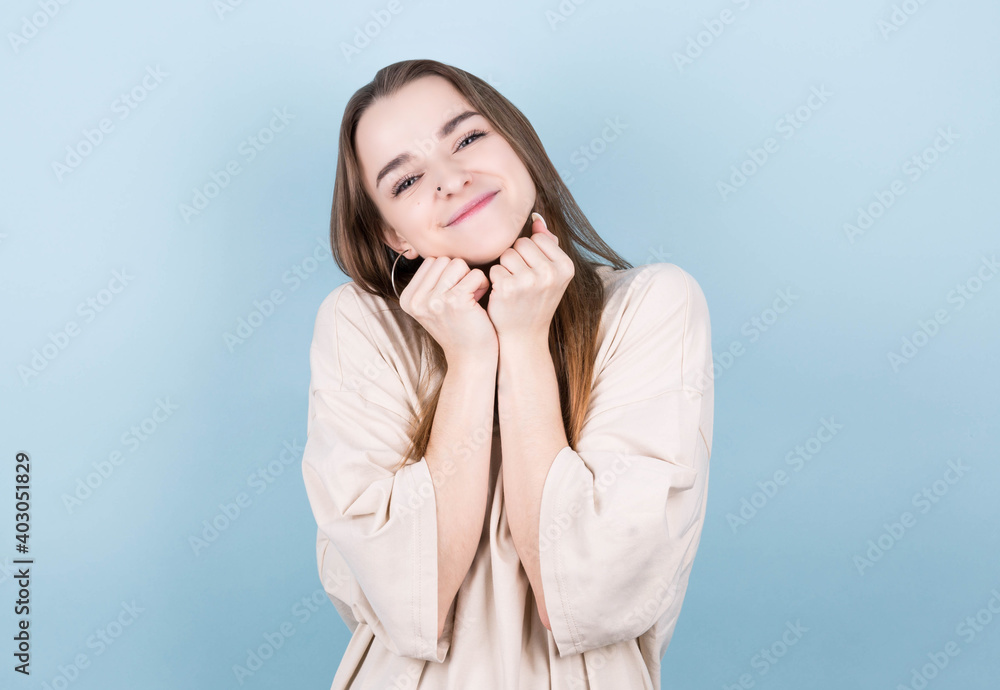 Happy cheerful young brunette teen looking at camera with joyful and charming smile. Happy cheerful young brunette teen looking at camera with joyful and charming smile.