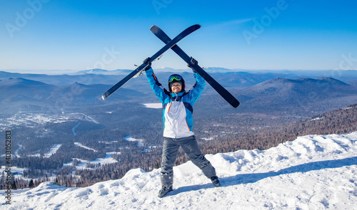Happy skier man with ski background snowy sunny mountains, concept sport active winter