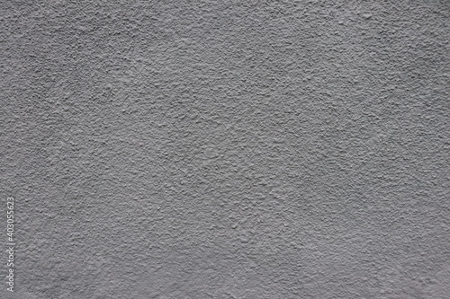Gray plaster on the wall of the building.