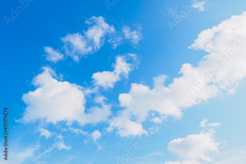 Fluffy clouds and clear blue sky background in summer