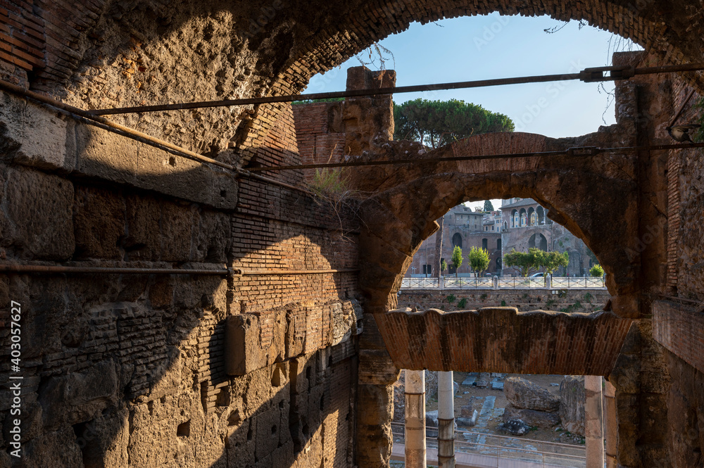 The Forum of Augustus, seen from the great arch in the Via dei Fori Imperiali. The facade, with a large arch surmounted by a cross window and the five-arched loggia. Rome The Forum of Augustus, seen from the great arch in the Via dei Fori Imperiali. The facade, with a large arch surmounted by a cross window and the five-arched loggia. Rome