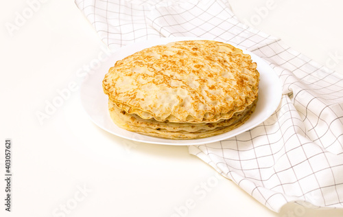 Pancake on a plate. Russian traditional holiday Maslenitsa.