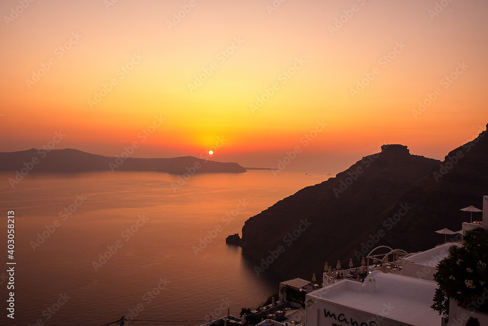 Magical sunset  in Santorini, summer time, trave, hot season