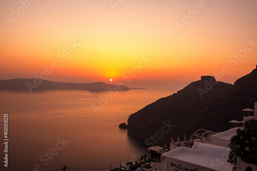 Magical sunset  in Santorini  summer time  trave  hot season