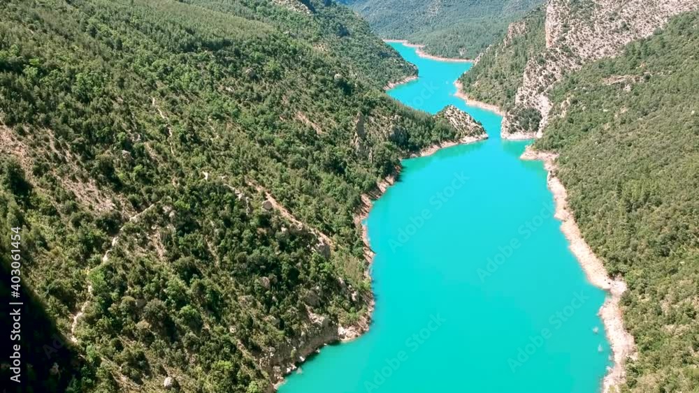 Water flow along the valley of Spain, Catalonia forest, drone moving over the Catalonia river Water flow along the valley of Spain, Catalonia forest, drone moving over the Catalonia river