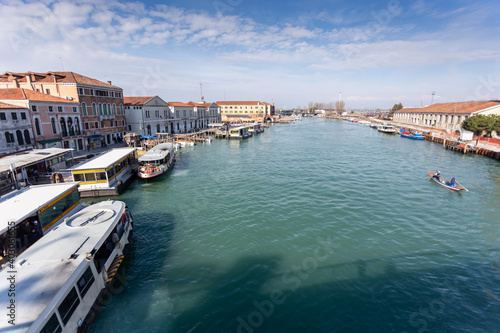 A small harbor for mooring and gondola is popular for sightseeing boat rides in the Venice city. © Chaksin
